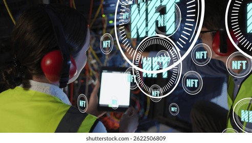 Image of nft texts over diverse workers in server room. global business and digital interface concept digitally generated image.