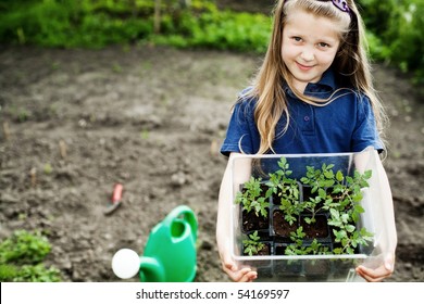An image of a nice little girl with seedlings - Powered by Shutterstock