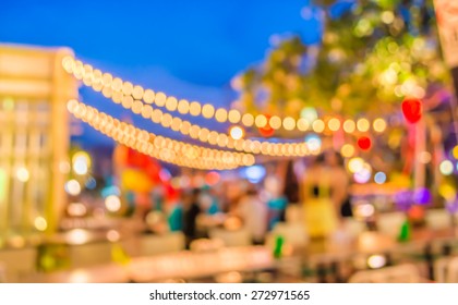  image of  night  festival on street blurred background with bokeh.