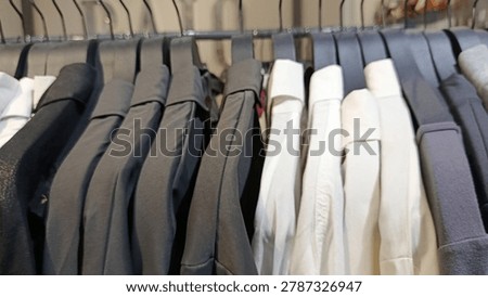 The image is not sharp, the buyer is picking out clothes in store, Indonesia, May 26, 2026