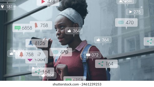 Image of notification bars over african american woman talking on speaker of cellphone. Digital composite, multiple exposure, business, growth, communication, social media and technology concept. - Powered by Shutterstock