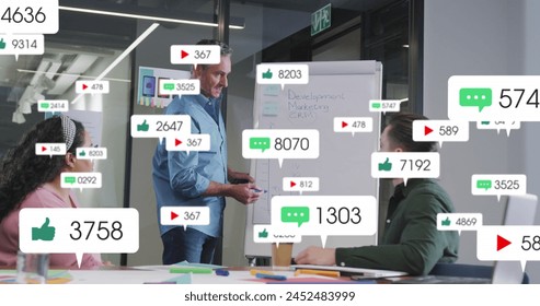 Image of notification bars over diverse manager explaining strategy to coworkers on whiteboard. Digital composite, multiple exposure, business, teamwork, planning, social media reminder concept. - Powered by Shutterstock