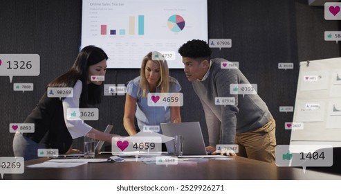 Image of notification bars over diverse coworkers discussing reports on laptop in office. Digital composite, multiple exposure, social media reminder, planning, teamwork and technology concept. - Powered by Shutterstock