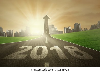 Image Of Numbers 2018 And Upward Arrow On The End Of Road. Symbolizing Better Future