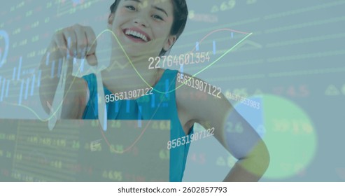 Image of numbers changing and financial data processing over woman holding shopping bag. global business and finance concept digitally generated image.