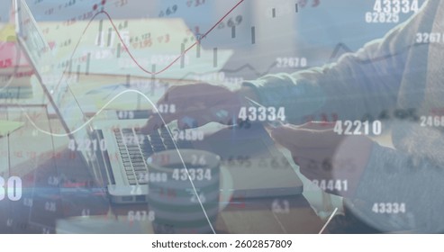 Image of numbers changing and financial data processing over man paying online using laptop. global business and finance concept digitally generated image.