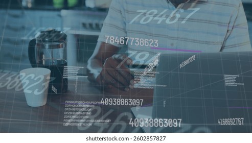 Image of numbers changing and financial data processing over man paying online using laptop. global business and finance concept digitally generated image.