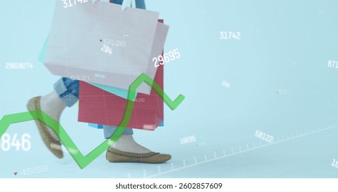 Image of numbers changing and green line financial data processing over woman with shopping bags. global business and finance concept digitally generated image.