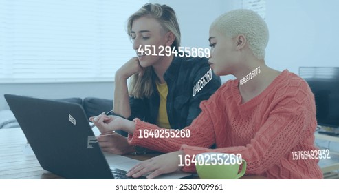 Image of numbers changing over caucasian women using laptop. Global social media, business, finance and data processing concept digitally generated image.
