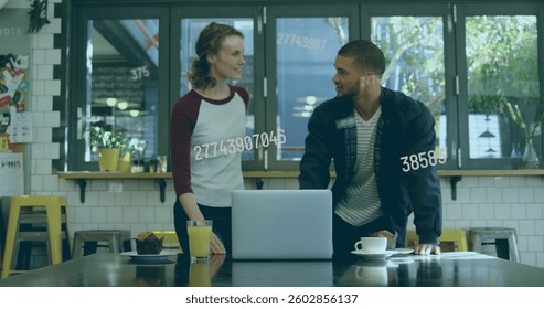 Image of numbers changing over man and woman using laptop. digital interface global connection and finance concept digitally generated image.