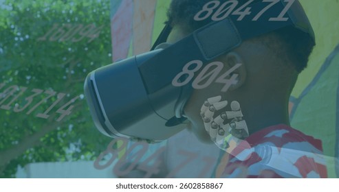 Image of numbers changing over robot's arm, network of connections and boy wearing vr headset. Digital interface global connection and communication concept digitally generated image.