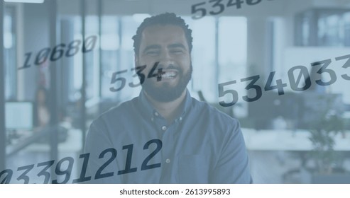 Image of numbers changing over smiling biracial businessman in office. global business and data processing concept digitally generated image. - Powered by Shutterstock - Get 15% off with code: PIKWIZARD15