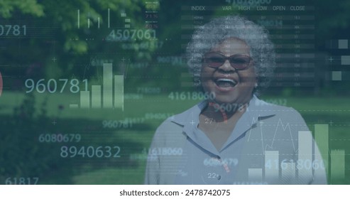 Image of numbers, infographic interface, laughing senior biracial woman standing outdoors. Digital composite, multiple exposure, report, business, growth and retirement concept. - Powered by Shutterstock