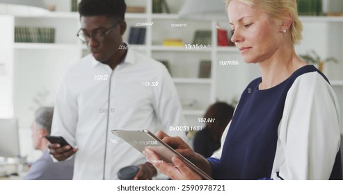 Image of numeric data processing over caucasian businesswoman using tablet at casual office. Business, connection, office, digital interface and communication, digitally generated image. - Powered by Shutterstock - Get 15% off with code: PIKWIZARD15