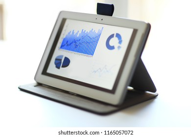 Image of an office workplace with document, touchpad - Powered by Shutterstock - Get 15% off with code: PIKWIZARD15