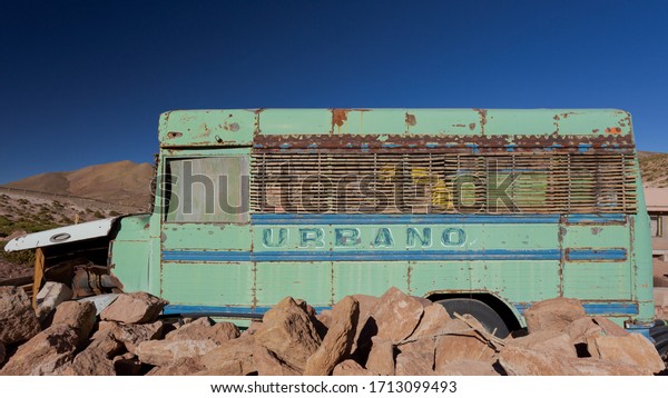 Image of an Old abandoned\
bus in Machuca village, Atacama dessert,  Antofagasta Region in \
Chile.