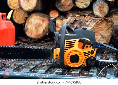 An Image Of An Old Chainsaw And Gas Can On The Tailgate Of An Old Truck.  