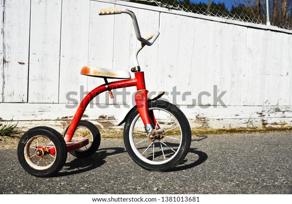 old red tricycle