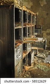 Image Of An Old Rusty Filing Cabinet In A Derelict Abandoned Police Station Covered In Debris.