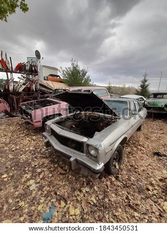 image of old scrap vehicles in a car dump