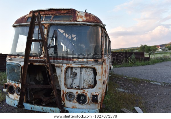 An image of an old Soviet Union era bus\
that shows a reference to the past to\
history
