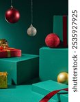 The image is on a luxurious emerald background, with green boxes to display the product, placed next to fruit boxes, decorated with Noel hanging balls and red ribbons to create a Christmas vibe.