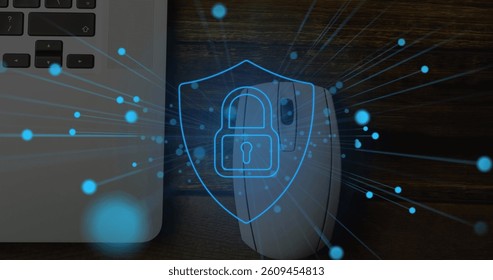 Image of online security padlock with blue spots over laptop and mouse in desk. global technology, networking and digital interface concept digitally generated image.