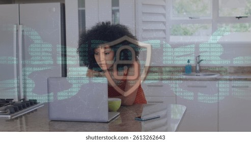 Image of online security padlock and chain over woman using laptop. global communication, connections, technology and digital interface concept digitally generated image.