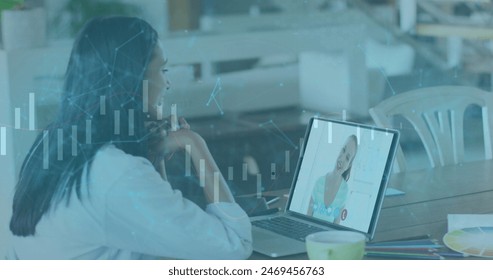 Image of online security padlocks over caucasian businesswoman on laptop image call. business, finance and data processing concept digitally generated image.