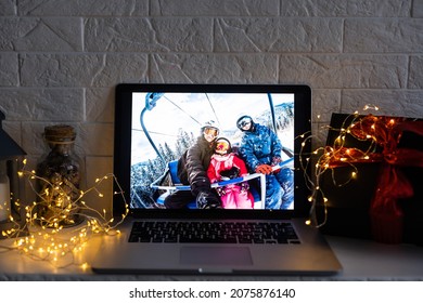 Image Of Open Laptop Family And Christmas On Wooden Table In Front Of Christmas Tree Background