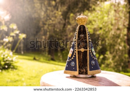 image of Our Lady of Aparecida, in a natural setting, space for text, copy space, catholic patron saint of brazil, christianity