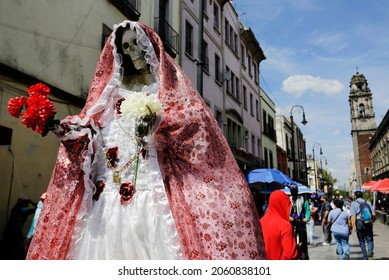 An Image Of Our Lady Of The Holy Death Or La Santa Muerte, A Mexican Female Deity, Is Seen In A Shopping Commercial Street Of Downtown Mexico City, Mexico.