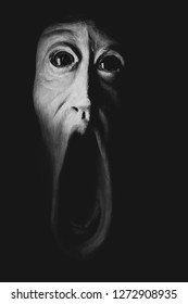 Image Of A Panicked Face Screaming In Fear. Picture Of Dread, Halloween Or Day Of The Dead. Halloween 2019, Concept Of Terrified Or Something Macro.