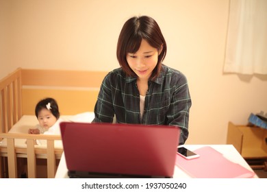 Image Of Parent And Child Using A Personal Computer 