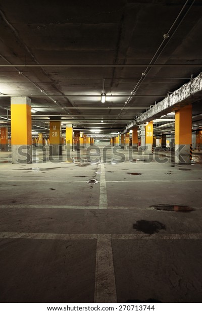 Image of parking garage\
underground interior, dark industrial building, modern public\
construction