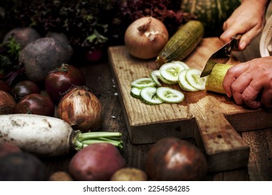 A image of person slicing vegetables - Shutterstock ID 2254584285