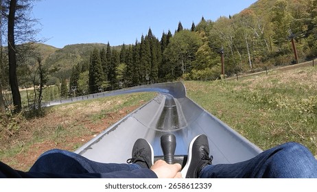 Image from the perspective of a runner sliding down the course in bobsledding.