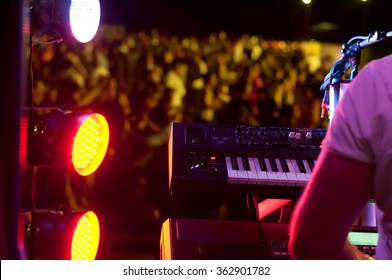 Image Of The Pianist, Piano And The Spotlight In The Concert And The Dancing Audience In The Background. Music Background