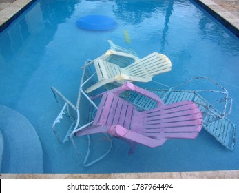 Image Of The Plastic Outdoor Furniture In The Pool To Prepare For Hurricane Isaias In Florida. 