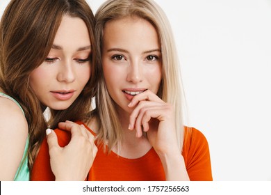 Image Of Pleased Beautiful Two Women Posing And Hugging At Camera Isolated Over White Background