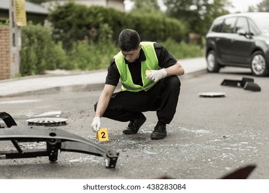 Image Of Police Officer Securing Car Accident Scene