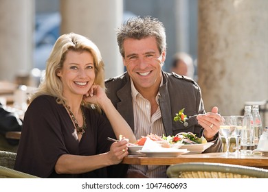 An Image Of Portrait Of A Couple Dining