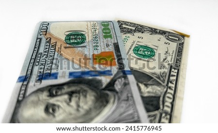 An image portraying a composition of 101 dollars, encompassing both 1 and 100 dollar banknotes, on a white backdrop.