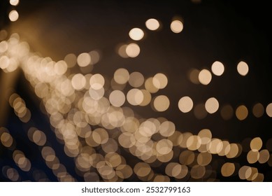 The image presents a blurry depiction filled with numerous bright lights scattered across a deep black backdrop, creating a captivating effect - Powered by Shutterstock