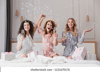 Image Of Pretty Happy Women 20s Wearing Dresses Celebrating Bridal Shower In Posh Apartment With Champagne And Confetti