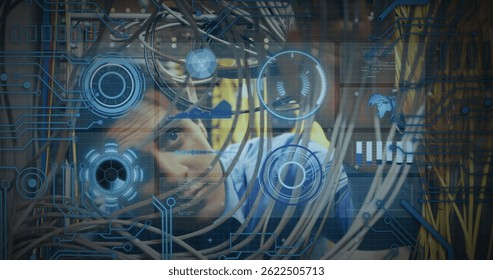 Image of processing circle over data and caucasian man checking computer wires. computers, network, data processing and digital interface concept digitally generated image.