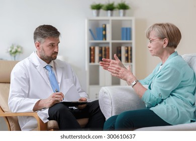 Image Of Psychiatrist Listening To His Female Patient With Depression