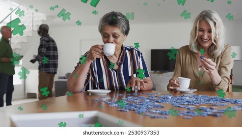 Image of puzzle over diverse group of seniors talking. senior home hangout and digital interface concept digitally generated image. - Powered by Shutterstock