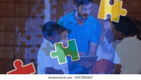 Image of puzzle pieces over diverse schoolchildren and teacher using tablet. autism awareness month and celebration concept digitally generated image. - Powered by Shutterstock