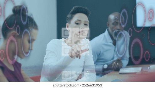 Image of qr code and data processing over diverse business people in office. Global connections, business, finance, computing and data processing concept digitally generated image.